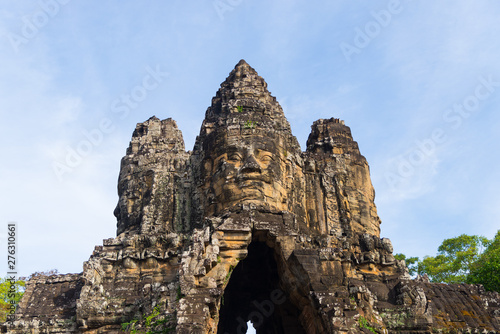 Stone faces in Bayon  Angkor Thom temple  selective focus sunset light. Buddhism meditation concept  world famous travel destination  Cambodia tourism.