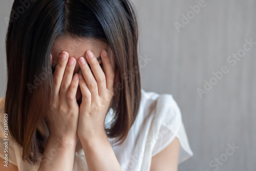 sad, depressed woman with facepalm gesture