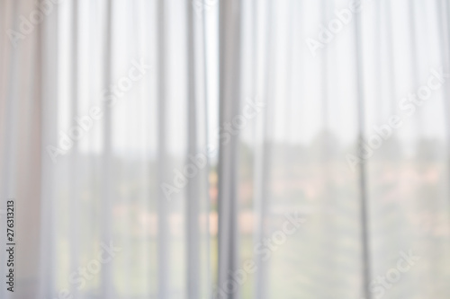 window curtain with green garden abstract blur background