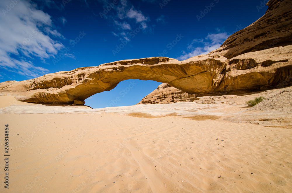 Natural arch in desert with sandstone and granite rock Wadi Rum in Jordan Natural arch in desert with sandstone and granite rock Wadi Rum in Jordan