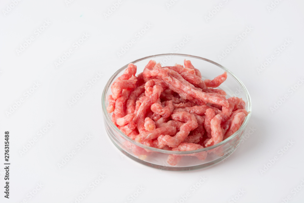 Minced meat in glass Petri dish for laboratory studies. Close up. Space for text. Chemical experiment. Minced meat in glass Petri dish for laboratory studies. Close up. Space for text. Chemical experiment.