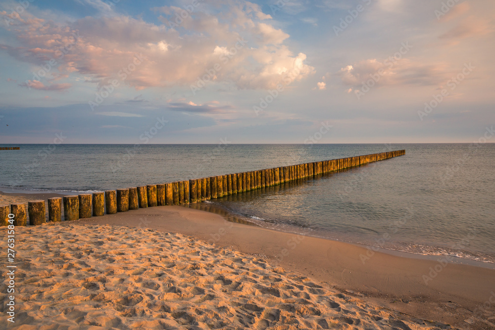 Breakwater at Baltic sea at sunny day in Trzesacz, Poland