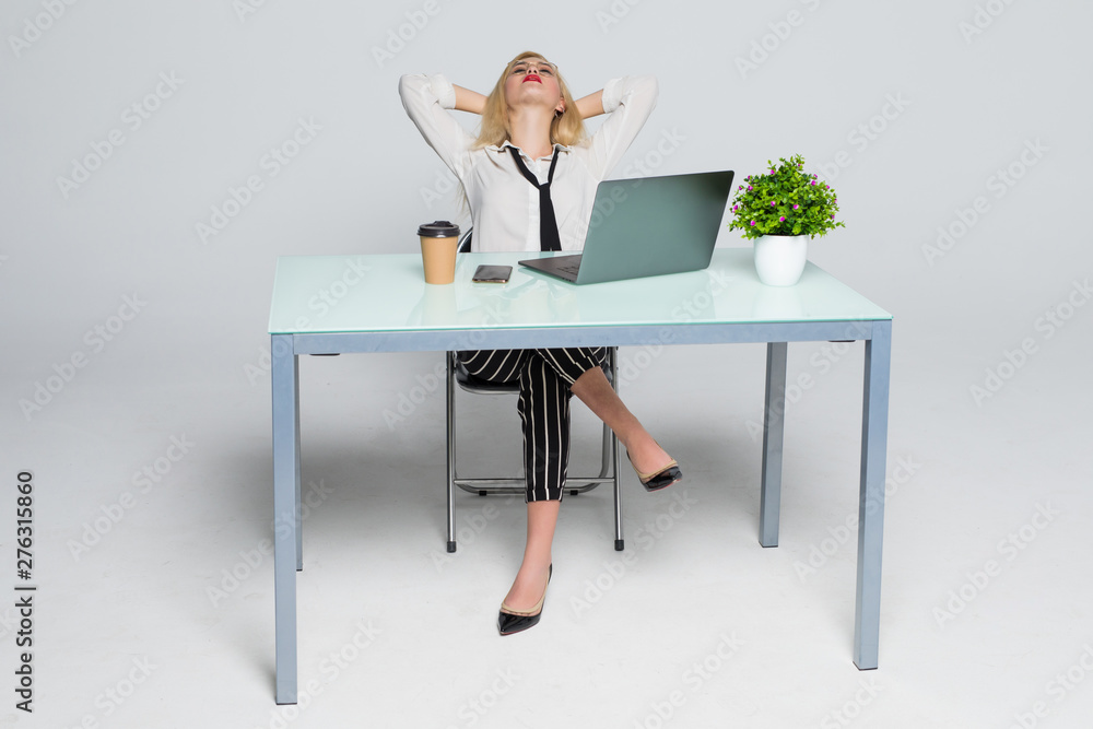 Calm smiling businesswoman relaxing at comfortable office chair hands behind head, happy woman resting in office satisfied after work done, enjoying break with eyes closed, peace of mind, no stress Calm smiling businesswoman relaxing at comfortable office chair hands behind head, happy woman resting in office satisfied after work done, enjoying break with eyes closed, peace of mind, no stress