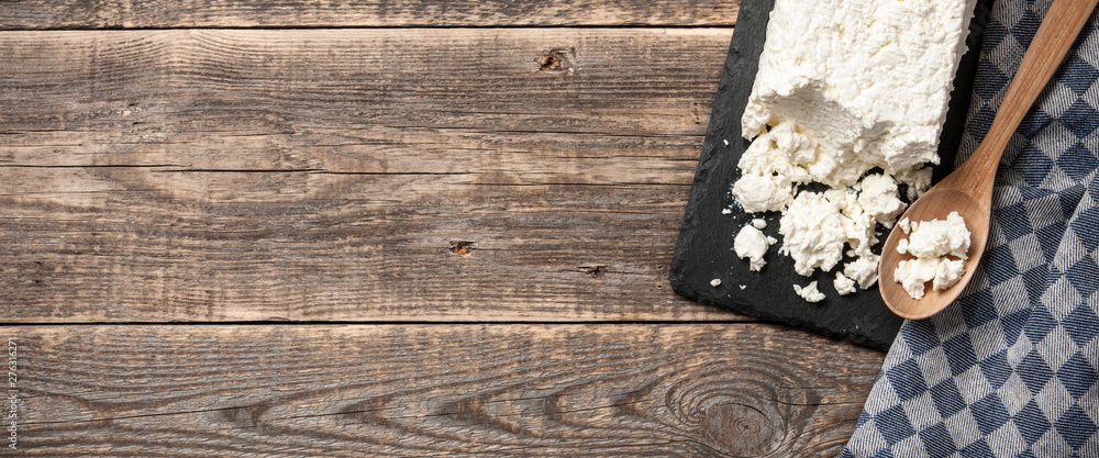Homemade cottage cheese on wooden table - obrazy, fototapety, plakaty 