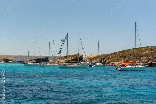 Panorama of the crystal clear blue waters of Santa Maria Beach in Santa Marija Bay, Comino, Malta.