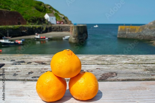  fresh oranges on the beach