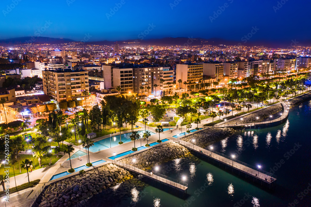 Fototapeta premium Limassol. Republic of Cyprus night panorama. Night Molos embankment. Limassol's promenade protruding into the sea from height. The mediterranean seaside. The Cyprus beaches. Traveling to the Cyprus.