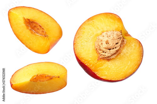 Nectarine with green leaf and slices isolated on white background. top view