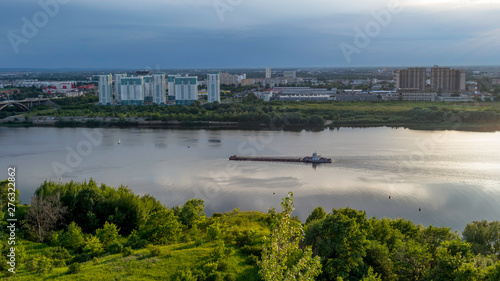 the barge is floating on the river