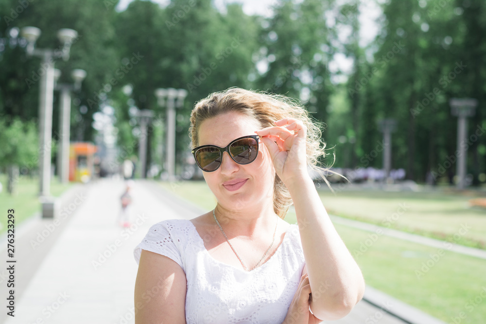 beautiful girl in summer city park