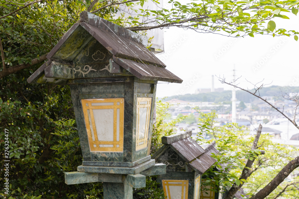 The green traditional light lamp pole at shrine, Japan style. The green traditional light lamp pole at shrine, Japan style.