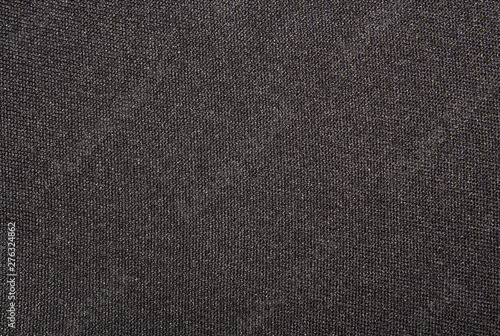 Texture of black dense fabric.Dark fabric background.