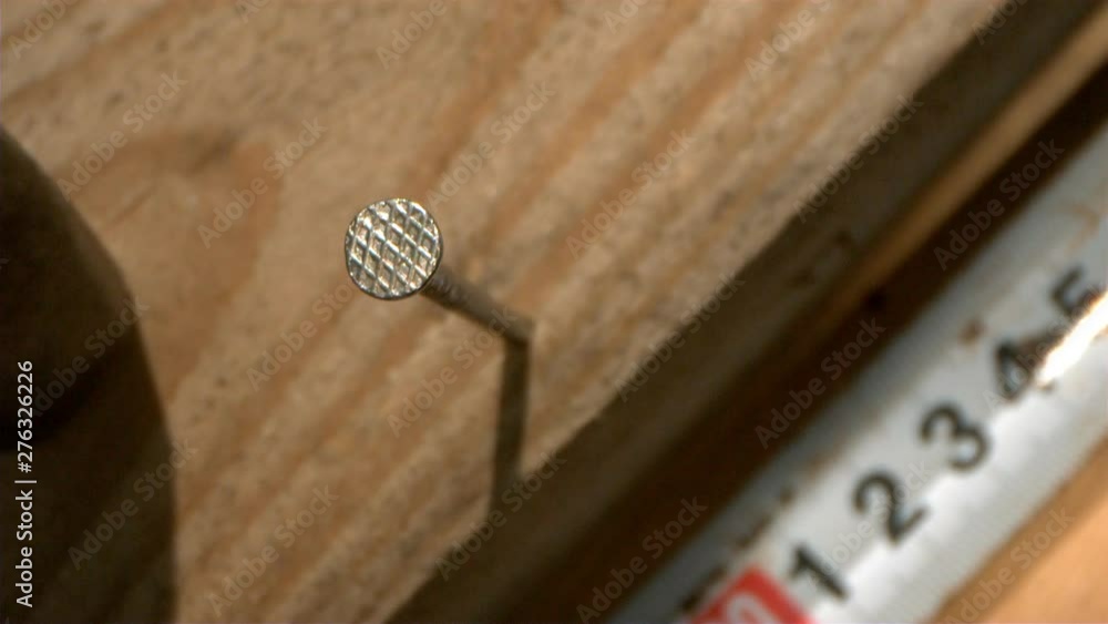 Hammer a Nail into a Wood Macro shot at 1000 fps Hammer a Nail into a Wood Macro shot at 1000 fps