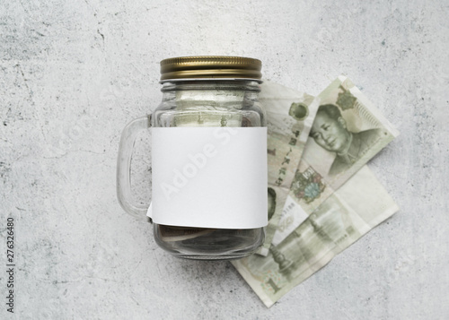 Money with glass jar