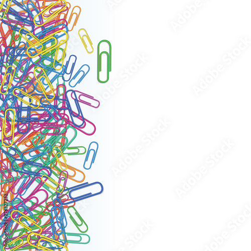 Heap of plastic multi colored paper clips isolated on white background. Design element for banner, school supplies. Stationery and office supply. Border with copy space.