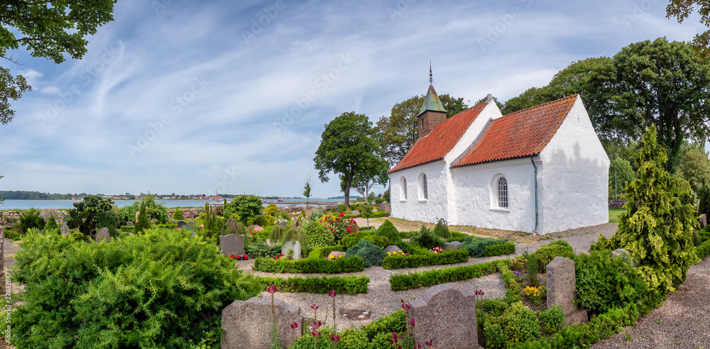 Naklejka premium Hjarnoe island church one of the smallest in Denmark