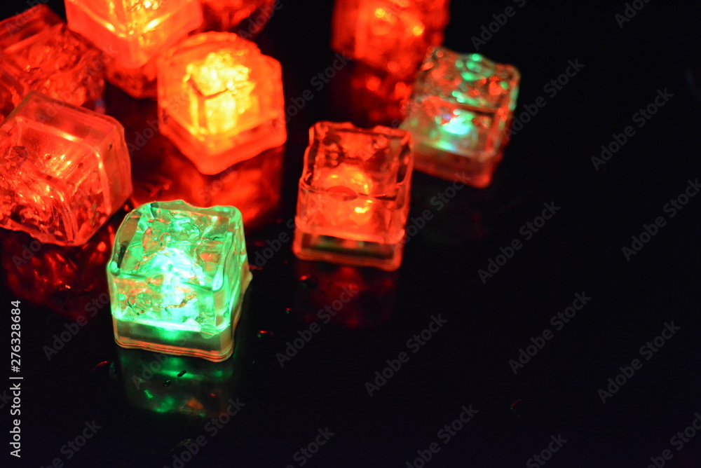 Original bright red glowing plastic cubes in total darkness. Awesome background, hellish and creepy red color, mixed glowing ice cubes. Original bright red glowing plastic cubes in total darkness. Awesome background, hellish and creepy red color, mixed glowing ice cubes.