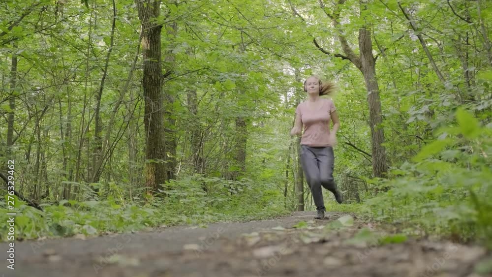 girl makes run along forest path when exhibitionist jumps out in front of her. woman feels fear and runs away from pervert man. girl makes run along forest path when exhibitionist jumps out in front of her. woman feels fear and runs away from pervert man.