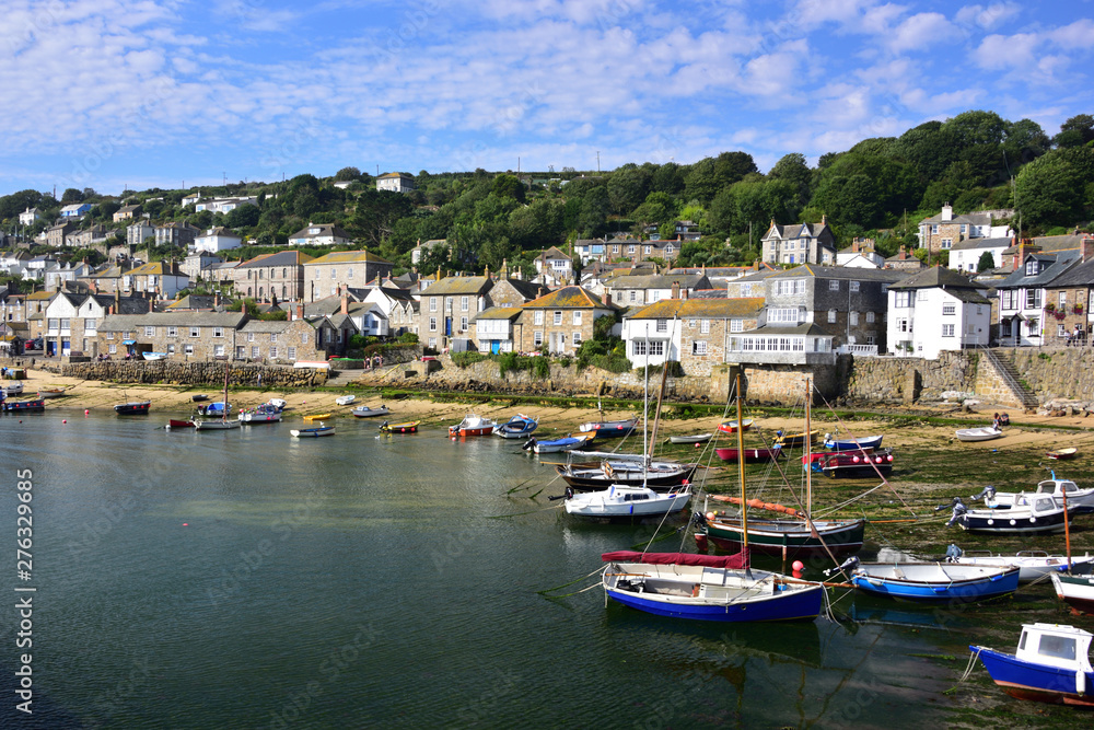 Mousehole Village & Harbour with boats, in Cornwall, England, Uk