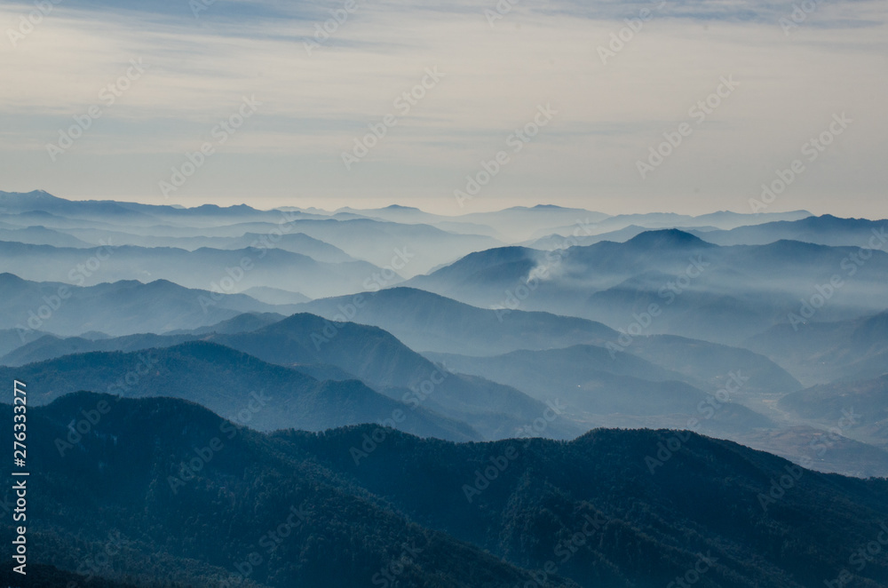 Aerial view of silhouetted  blue mountains