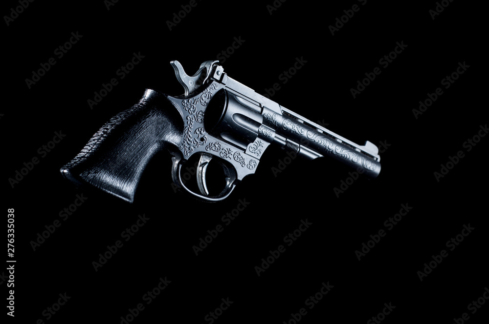 Plastic gun on a black background, isolate Plastic gun on a black background, isolate