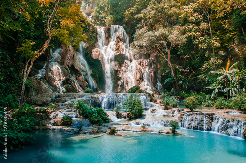 Fototapeta Naklejka Na Ścianę i Meble -  Blue water pond Kuang Si waterfall in Luang Prabang, Laos during summer season.