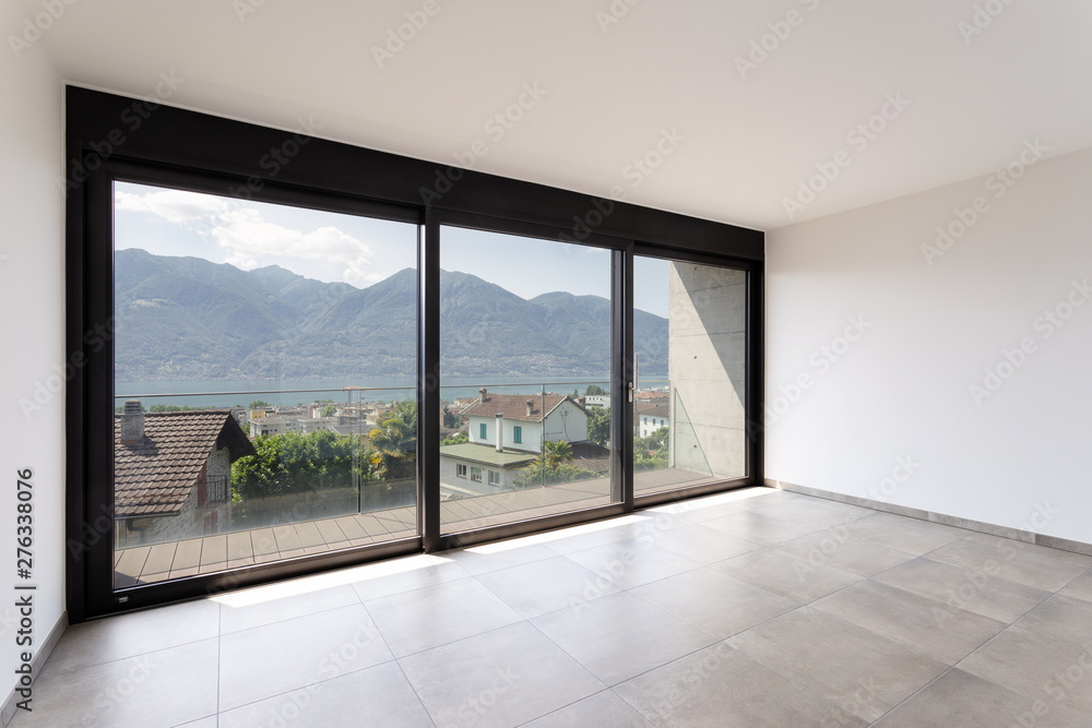 Fototapeta premium Room with black window overlooking Lake Maggiore