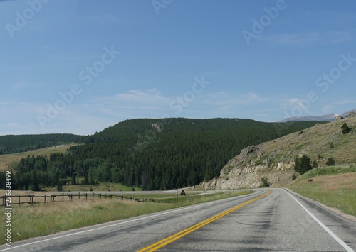 Pleasant drive along Highway 16 at Bighorn National Forest which covers over a million acres in Wyoming. © raksyBH