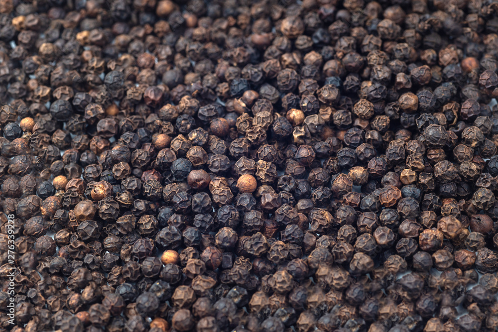 Black pepper grains as background close up Black pepper grains as background close up