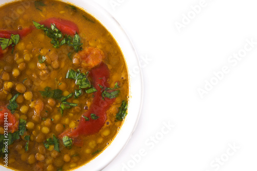 Indian lentil soup dal (dhal) in a bowl isolated on white background. Top view. Copyspace