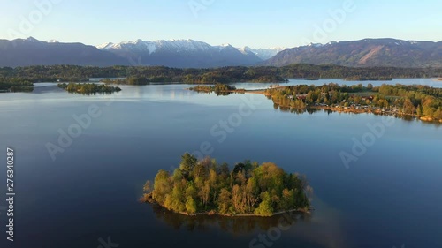 Flight over the island of Mühlwörth in lake Staffelsee in Bavaria, Germany photo