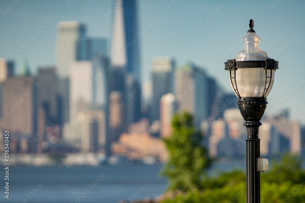Lamp post with New York City in the background