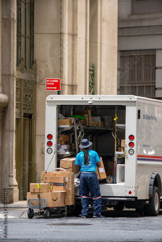 USPS delivery man and van in Manhattan NYC photo