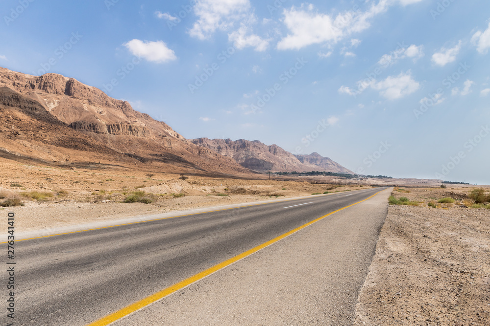 Panoramic  view of the road, coast of Dead Sea and mountains in the Judean Desert in the Dead Sea region in Israel