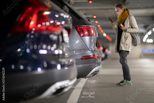 Photos Underground garage or modern car parking with lots of vehicles, perspective of t