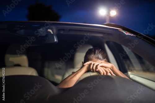 Принти на полотні Young female driver at the wheel of her car, super tired, falling asleep while d