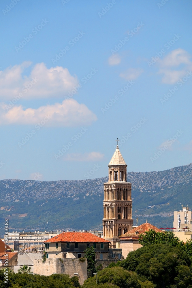 Saint Domnius bell tower, landmark in Split, Croatia, surrounded with trees.