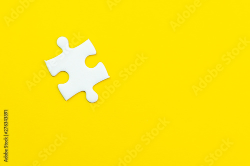 Last only one missing jigsaw puzzle on solid yellow background using as important thing combine or working together to success or solve problem