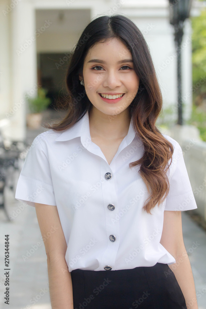 Portrait of thai adult student university uniform beautiful girl relax and smile