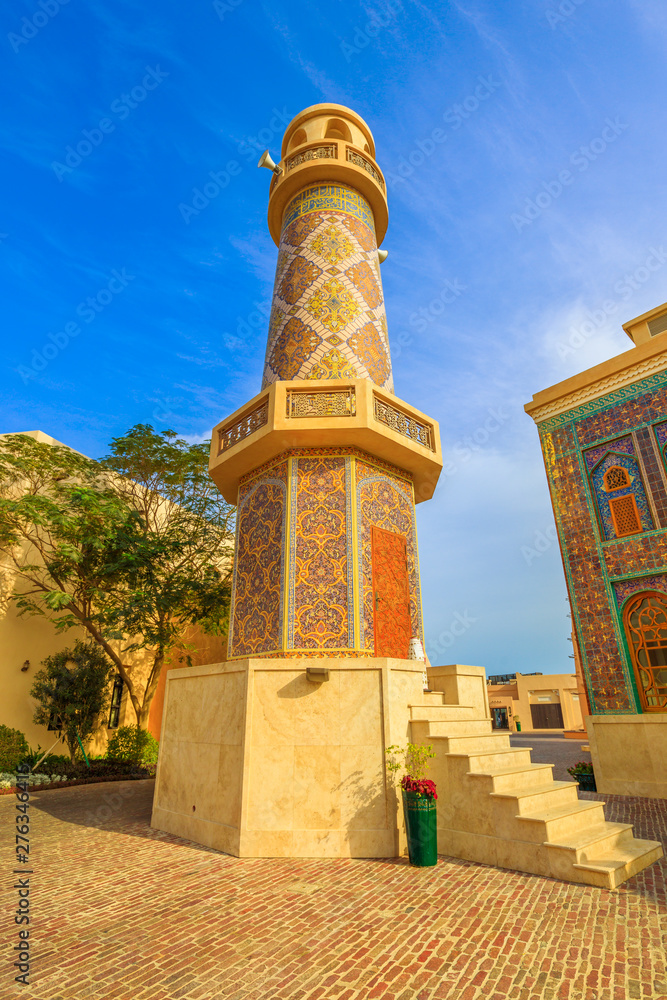 Historic Minaret in Katara. Katara is a cultural village also named valley of cultures in Doha, West Bay, Qatar. Middle East, Arabian Peninsula. Daylight. Vertical shot.