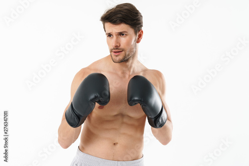 Handsome young fit shirtless sportsman standing