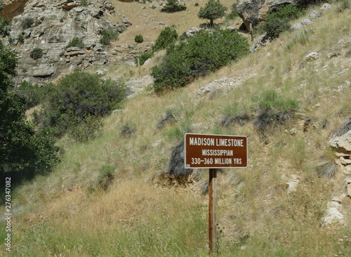 Roadside sign of Madison limestone rocks dating from 300 to 360 million years back along the road through Bighorn Mountains in Wyoming. photo