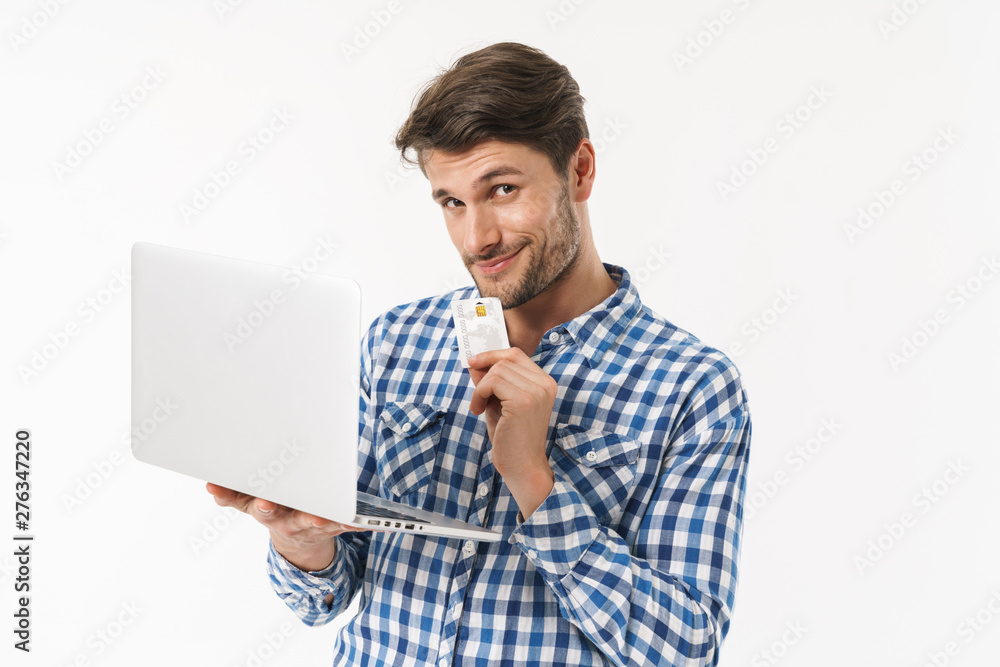 Attractive young brunette man wearing plaid shirt Attractive young brunette man wearing plaid shirt