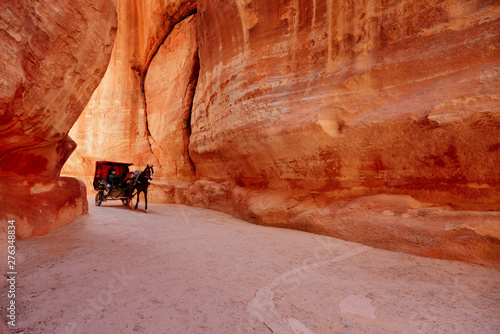 The Sig. Main entrance to the ancient city of Petra. Horse carriage ferries tourist. Southern Jordan