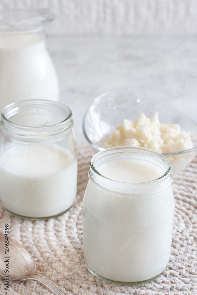 Fermented drink kefir in small bottles and kefir grains Fermented drink kefir in small bottles and kefir grains