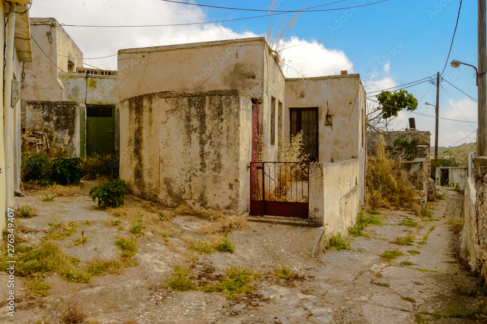 Old abandoned town. Narrow street in old Greek village. Traditional buildings. Old abandoned town. Narrow street in old Greek village. Traditional buildings.
