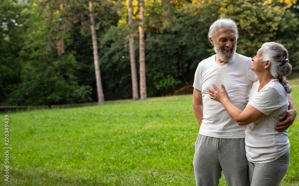 Beautiful senior couple is working out in the park Beautiful senior couple is working out in the park