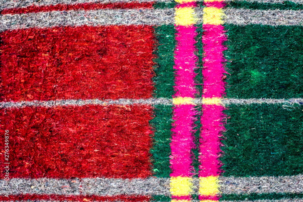 Close up shot of rough texture of woven carpet with some minimal design of square and linings on it. Close up shot of rough texture of woven carpet with some minimal design of square and linings on it.