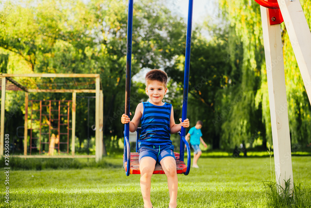boy on swing boy on swing