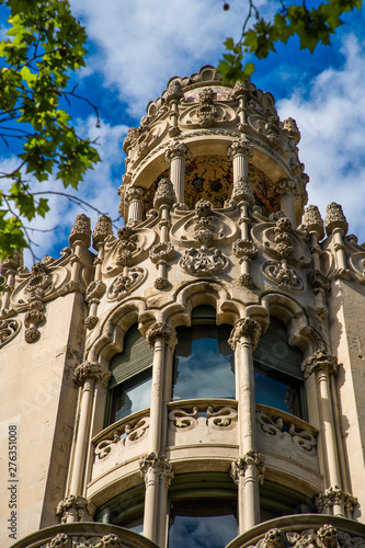 BARCELONA, CATALONIA - APRIL 2019: Passeig de Gracia in Barcelona, Catalonia. It one of major avenue in city. Located in the Eixample district. Shopping and business areas photo